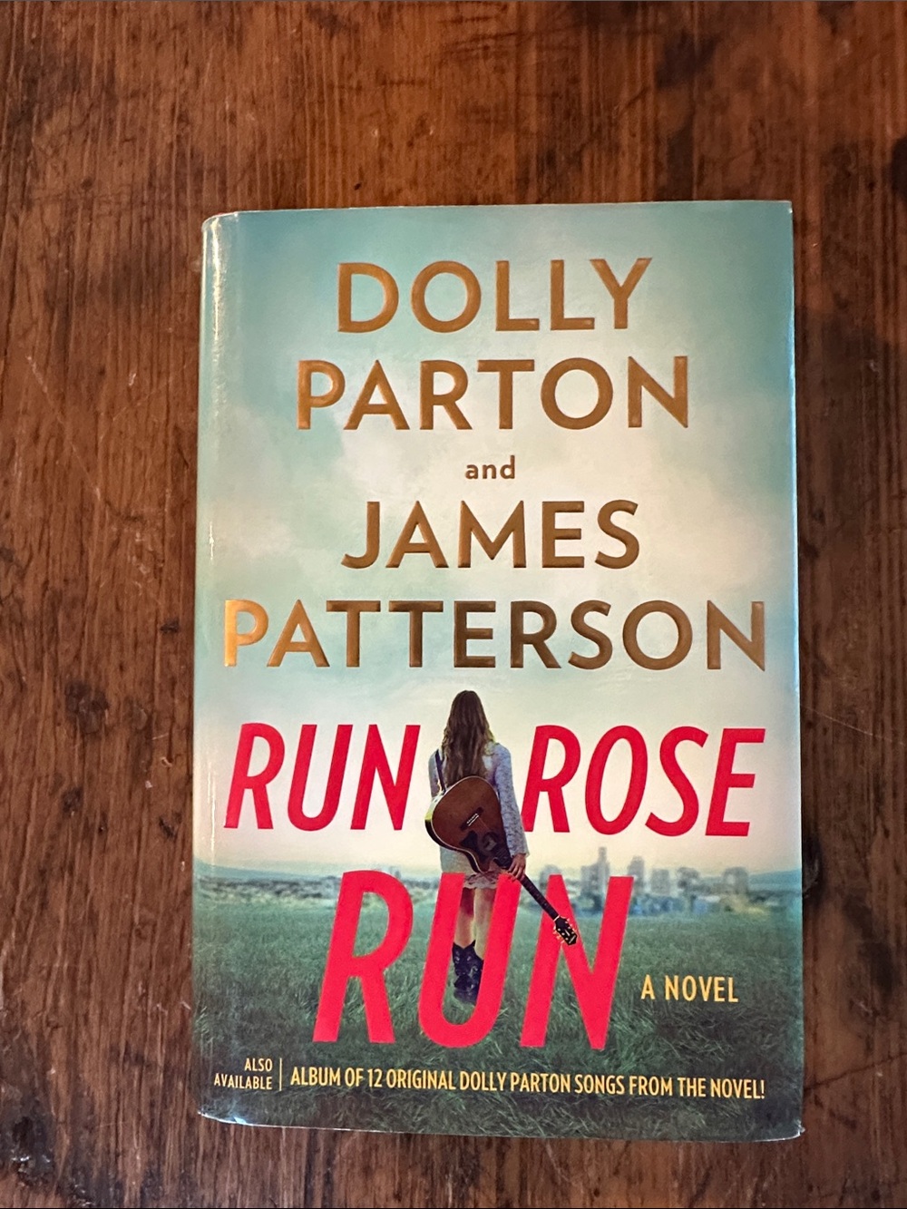 Run Rose Run by Dolly Parton & James Patterson - Teal and Red Paperback